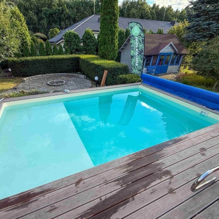 Pool AQUA 8.5 x 4.35 - H.1.45 m mit Liegefläche, grau, mit am Beton verschraubten Stahlprofilen