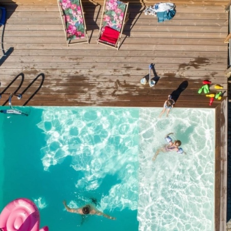 Pool AQUA 10.2 x 5.2 - H.1.45 m mit Liegefläche, sandfarben, mit am Beton verschraubten Stahlprofilen